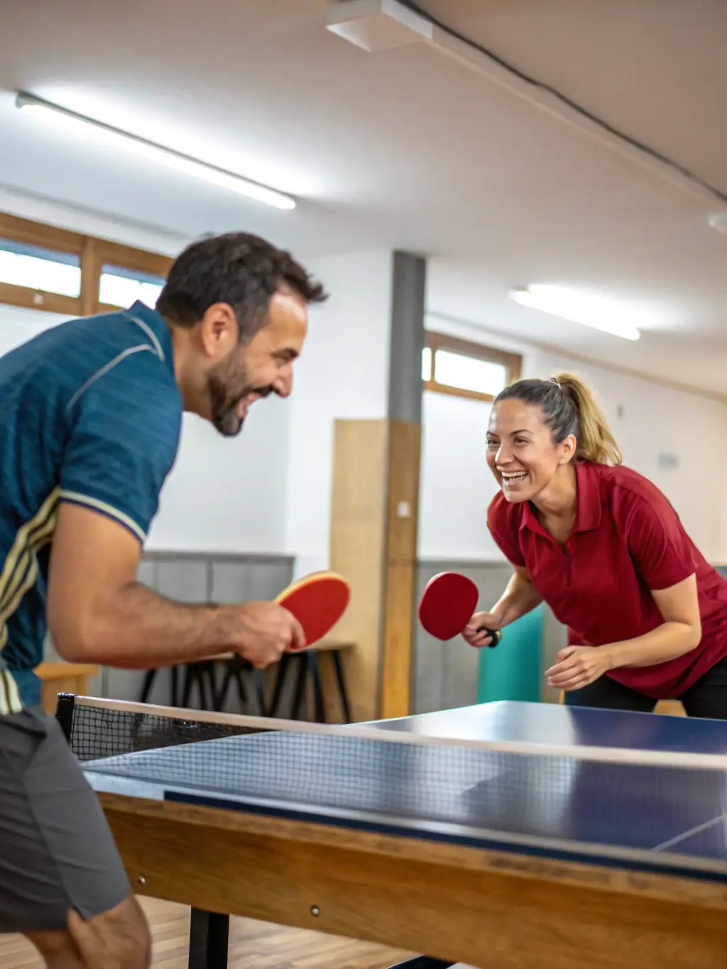 A photograph of adult players engaged in a competitive table tennis match at GAILLON AUBEVOYE TENNIS DE TABLE, showcasing skill and intensity.
